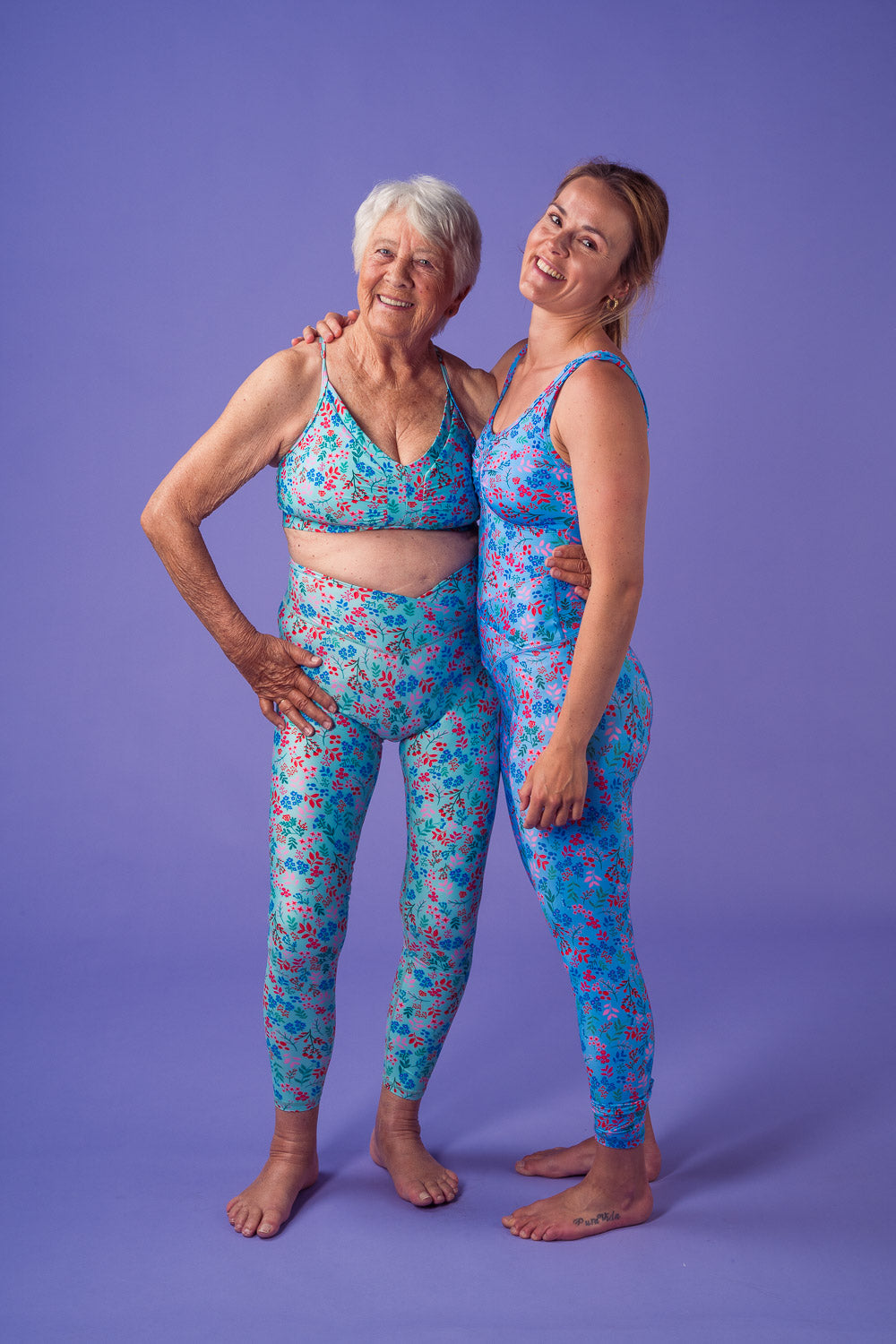 Two models wearing SELMA bikini top and tights, and Helene swimsuit and tights.